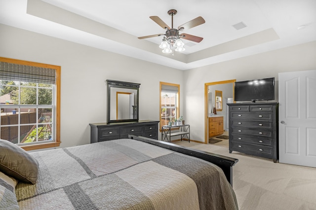 1190 E Headley St, Springfield, MO 65803 - bedroom featuring light carpet, a raised ceiling, a ceiling fan, and ensuite bathroom