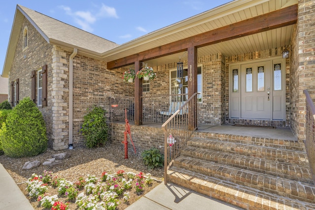 1190 E Headley St, Springfield, MO 65803 - entrance to property featuring a porch, brick siding, and a shingled roof
