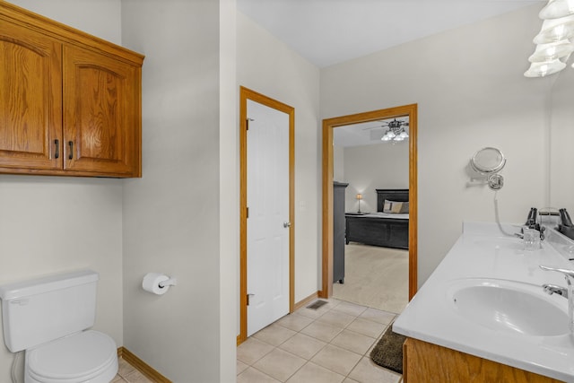 1190 E Headley St, Springfield, MO 65803 - full bathroom with double vanity, tile patterned floors, and ceiling fan
