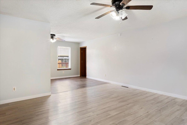 1219 N Clifton Ave, Springfield, MO 65802 - unfurnished room featuring a ceiling fan, a textured ceiling, and wood finished floors