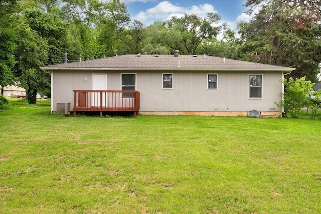 1219 N Clifton Ave, Springfield, MO 65802 - back of house featuring a wooden deck, a yard, view of scattered trees, and roof with shingles