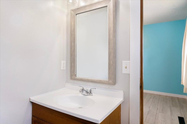 1219 N Clifton Ave, Springfield, MO 65802 - bathroom with vanity and wood finished floors