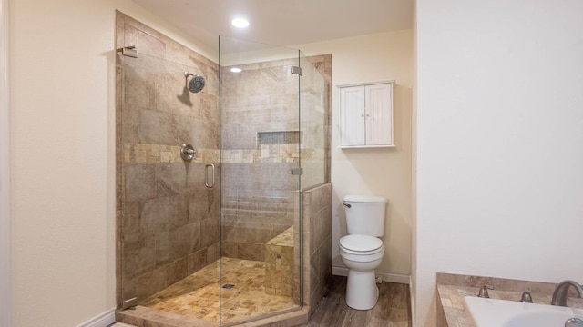 24 Oniatara Ln, Cherokee Village, AR 72529 - full bathroom with a stall shower, a bath, and wood finished floors