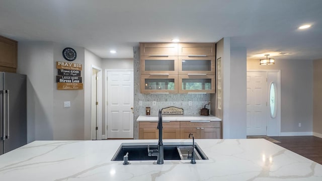 24 Oniatara Ln, Cherokee Village, AR 72529 - kitchen featuring freestanding refrigerator, wood finished floors, decorative backsplash, light stone countertops, and recessed lighting