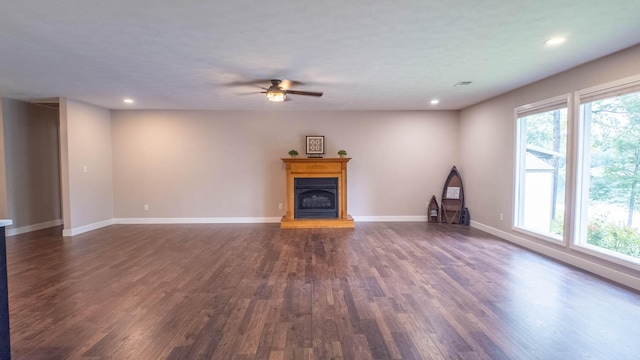 24 Oniatara Ln, Cherokee Village, AR 72529 - unfurnished living room with ceiling fan, dark wood-style flooring, a fireplace with raised hearth, and recessed lighting