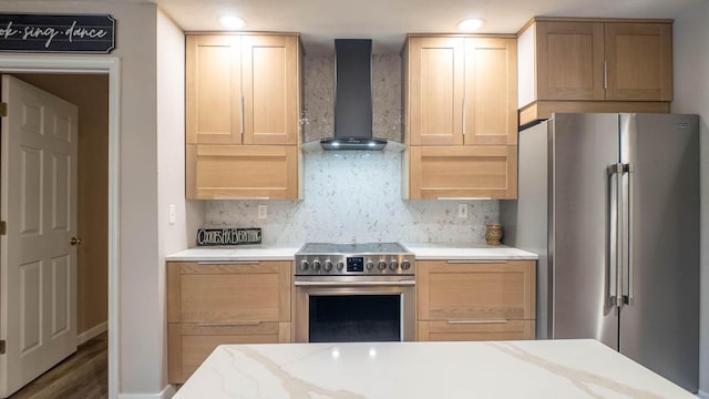 24 Oniatara Ln, Cherokee Village, AR 72529 - kitchen with stainless steel appliances, wall chimney exhaust hood, light brown cabinets, backsplash, and wood finished floors