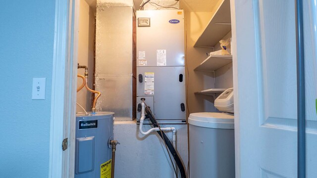 24 Oniatara Ln, Cherokee Village, AR 72529 - utility room with electric water heater