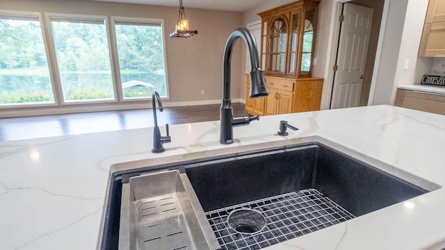 24 Oniatara Ln, Cherokee Village, AR 72529 - kitchen view of light stone counters and hanging light fixtures