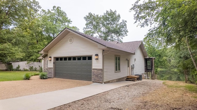 24 Oniatara Ln, Cherokee Village, AR 72529 - single story home featuring concrete driveway, a garage, a shingled roof, and stone siding