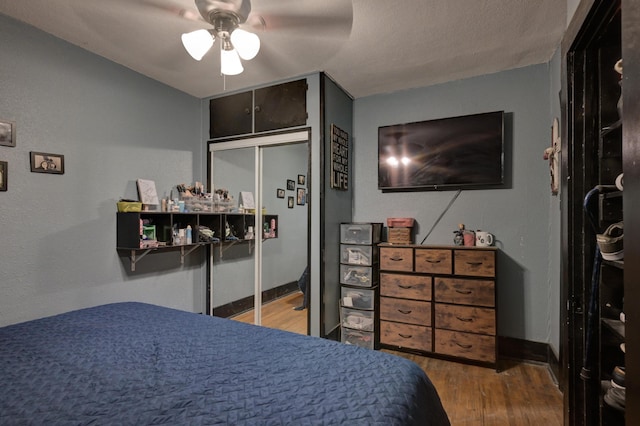 207 W Grand, Neosho, MO 64850 - bedroom featuring wood finished floors and a ceiling fan