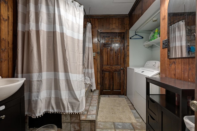 207 W Grand, Neosho, MO 64850 - washroom with washer and dryer and wood walls