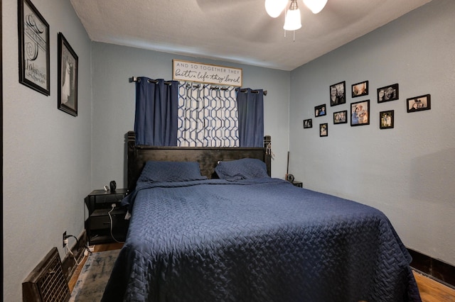 207 W Grand, Neosho, MO 64850 - bedroom with wood finished floors and a ceiling fan