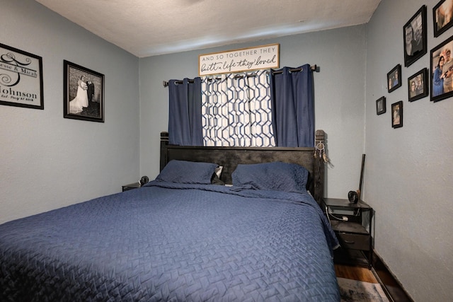 207 W Grand, Neosho, MO 64850 - bedroom featuring wood finished floors and baseboards