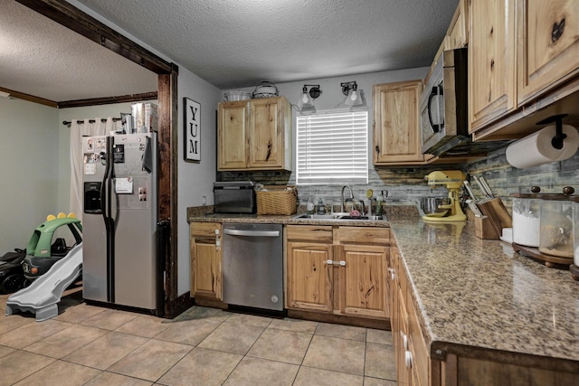 207 W Grand, Neosho, MO 64850 - kitchen with stainless steel appliances, a textured ceiling, decorative backsplash, and light tile patterned flooring