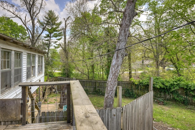 207 W Grand, Neosho, MO 64850 - wooden terrace with a fenced backyard and a gate