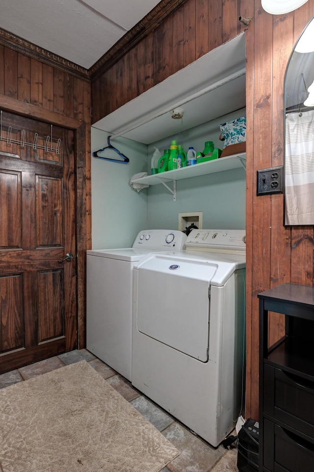 207 W Grand, Neosho, MO 64850 - washroom with washing machine and dryer and wooden walls