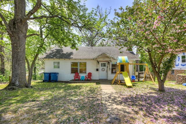 207 W Grand, Neosho, MO 64850 - view of front facade featuring a playground