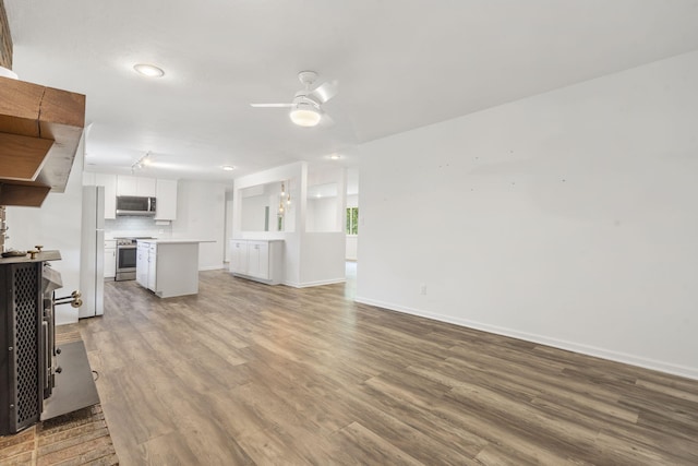 5295 E Farm Road 138, Springfield, MO 65809 - unfurnished living room with ceiling fan, wood finished floors, and recessed lighting