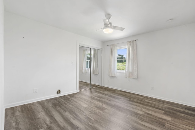 5295 E Farm Road 138, Springfield, MO 65809 - unfurnished bedroom featuring wood finished floors, a closet, and a ceiling fan