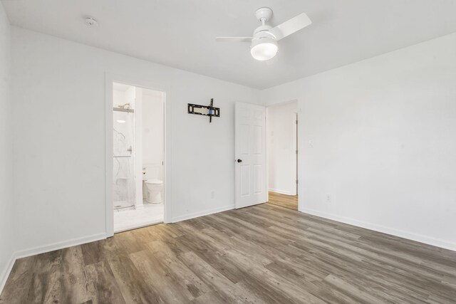 5295 E Farm Road 138, Springfield, MO 65809 - unfurnished bedroom with wood finished floors, ensuite bathroom, and ceiling fan
