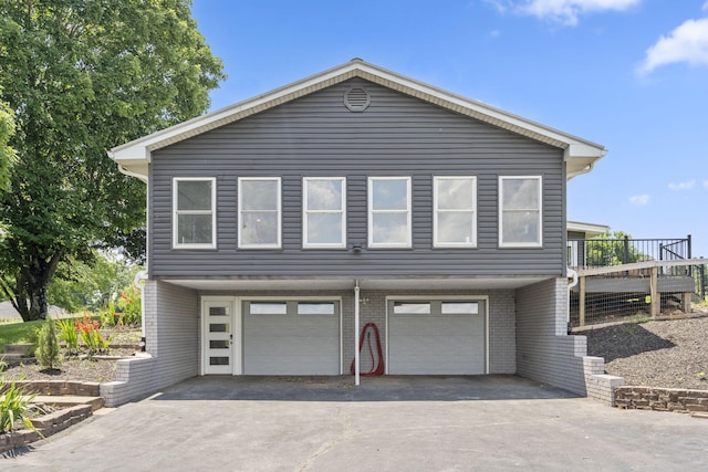 5295 E Farm Road 138, Springfield, MO 65809 - view of front of property with a garage, asphalt driveway, and brick siding
