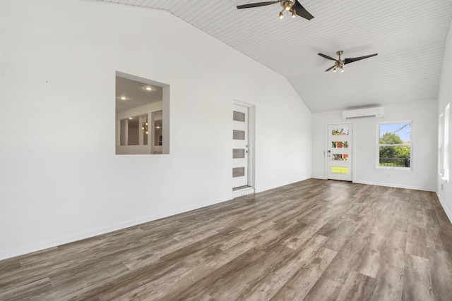 5295 E Farm Road 138, Springfield, MO 65809 - unfurnished living room featuring a wall mounted AC, vaulted ceiling, a ceiling fan, and wood finished floors
