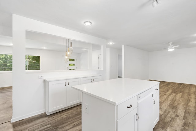 5295 E Farm Road 138, Springfield, MO 65809 - kitchen with dark wood-type flooring, light countertops, white cabinets, a kitchen island, and open floor plan