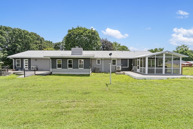 5295 E Farm Road 138, Springfield, MO 65809 - back of property featuring a sunroom, a chimney, and a lawn