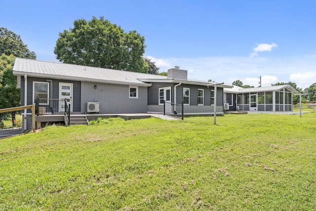 5295 E Farm Road 138, Springfield, MO 65809 - rear view of property featuring a sunroom, a chimney, a yard, brick siding, and a wooden deck