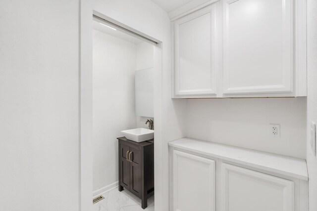 5295 E Farm Road 138, Springfield, MO 65809 - washroom featuring a sink and light marble finish flooring