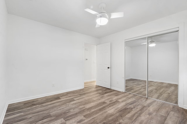 5295 E Farm Road 138, Springfield, MO 65809 - unfurnished bedroom featuring wood finished floors, a closet, and ceiling fan