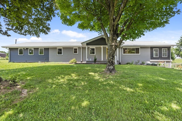 5295 E Farm Road 138, Springfield, MO 65809 - ranch-style home featuring a front yard, a metal roof, and brick siding