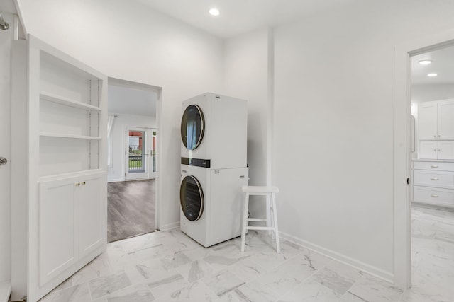 5295 E Farm Road 138, Springfield, MO 65809 - laundry area featuring stacked washer / dryer, light marble finish flooring, and recessed lighting