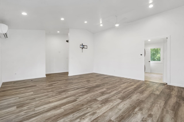5295 E Farm Road 138, Springfield, MO 65809 - spare room featuring a ceiling fan, a wall mounted air conditioner, wood finished floors, and recessed lighting