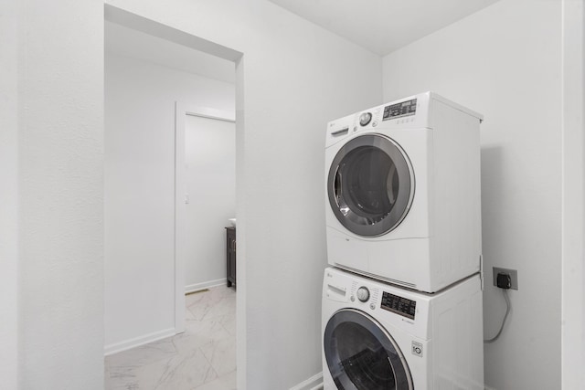 5295 E Farm Road 138, Springfield, MO 65809 - laundry area with stacked washer and clothes dryer and light marble finish flooring