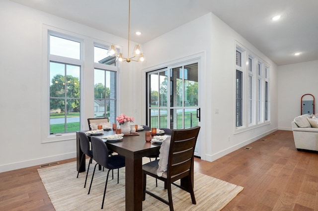 5030 E Swale Ct, Springfield, MO 65802 - dining space featuring healthy amount of natural light, light wood-style flooring, a chandelier, and recessed lighting