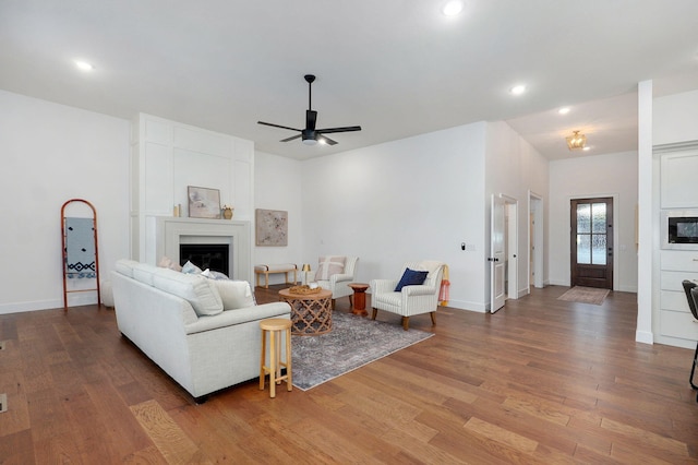 5030 E Swale Ct, Springfield, MO 65802 - living room with a ceiling fan, wood finished floors, a fireplace, and recessed lighting