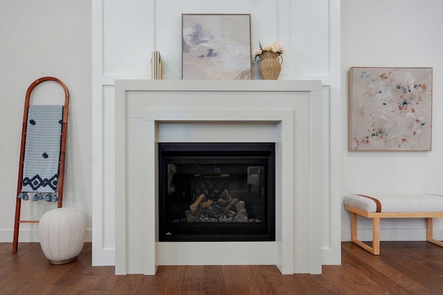 5030 E Swale Ct, Springfield, MO 65802 - detailed view of wood finished floors and a glass covered fireplace