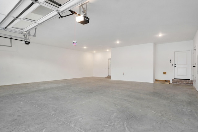 5030 E Swale Ct, Springfield, MO 65802 - garage with a garage door opener and recessed lighting