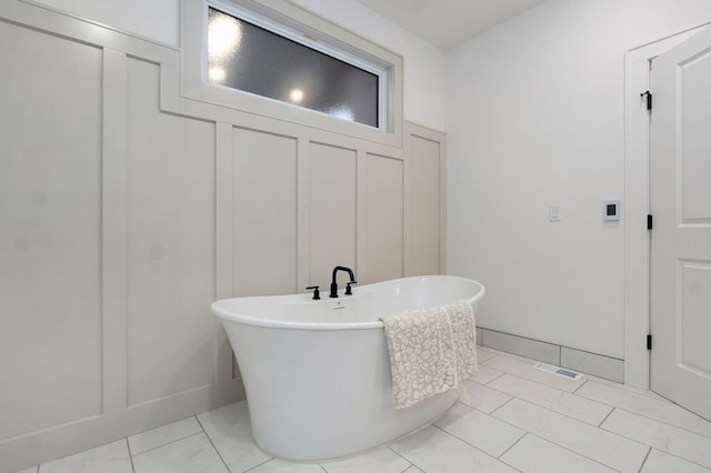 5030 E Swale Ct, Springfield, MO 65802 - full bath featuring a freestanding bath and a decorative wall