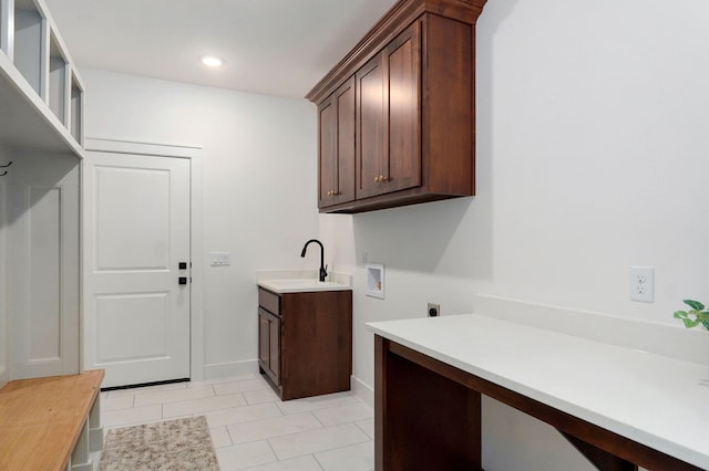 5030 E Swale Ct, Springfield, MO 65802 - laundry room featuring hookup for an electric dryer, hookup for a washing machine, cabinet space, light tile patterned floors, and recessed lighting