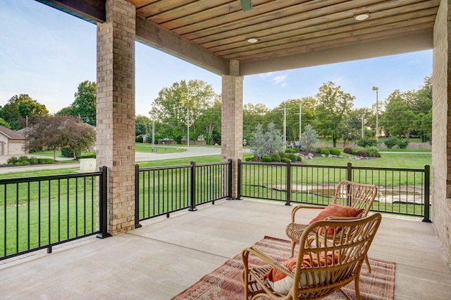 5030 E Swale Ct, Springfield, MO 65802 - porch featuring a lawn and view of scattered trees