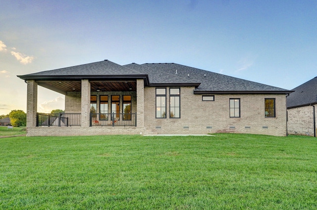 5030 E Swale Ct, Springfield, MO 65802 - back of house featuring crawl space, a shingled roof, a yard, and brick siding
