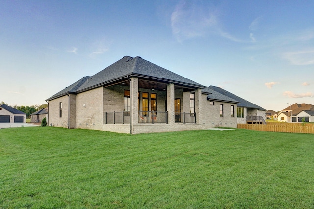 5030 E Swale Ct, Springfield, MO 65802 - rear view of house featuring brick siding and roof with shingles