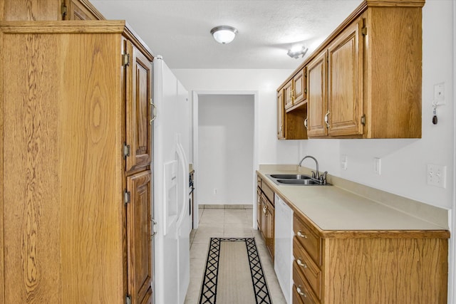 855 Birch St, Nixa, MO 65714 - kitchen with white appliances, light countertops, light tile patterned flooring, a textured ceiling, and brown cabinetry