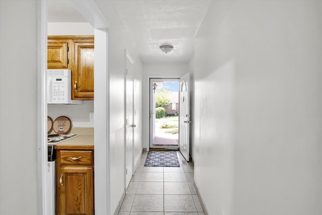 855 Birch St, Nixa, MO 65714 - doorway to outside featuring baseboards and light tile patterned floors