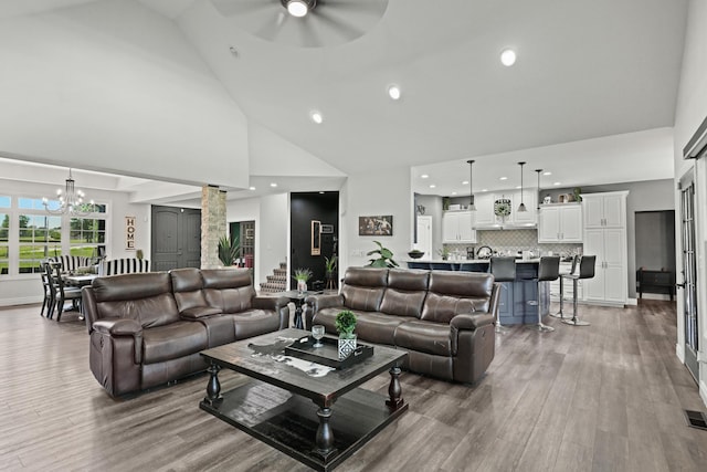13030 County Lane 228, Oronogo, MO 64855 - living area with high vaulted ceiling, a chandelier, a ceiling fan, wood finished floors, and recessed lighting