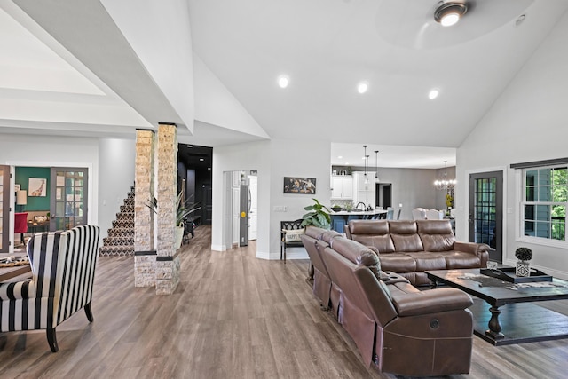 13030 County Lane 228, Oronogo, MO 64855 - living area featuring high vaulted ceiling, a chandelier, light wood finished floors, plenty of natural light, and recessed lighting