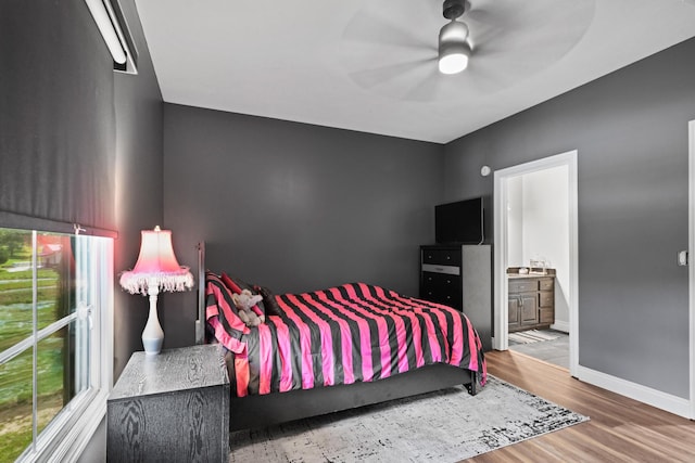 13030 County Lane 228, Oronogo, MO 64855 - bedroom with wood finished floors, ensuite bathroom, and a ceiling fan