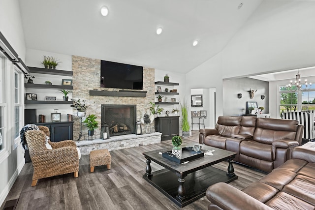 13030 County Lane 228, Oronogo, MO 64855 - living area featuring a chandelier, wood finished floors, high vaulted ceiling, a stone fireplace, and built in shelves